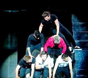 Group of Men in Human Pyramid