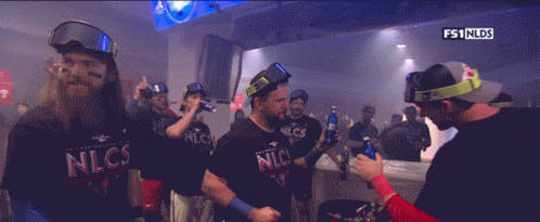 Group of Men in nlcs Shirts Dark Room