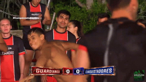 Group of Men in Red and Black Exatlon Shirts