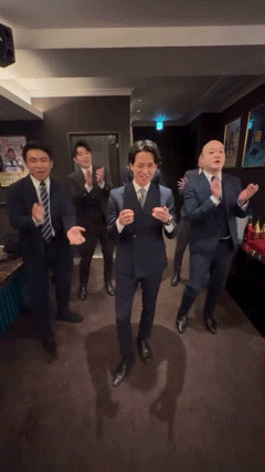 Group of Men in Suits Dancing