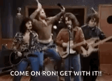 Group of Men Playing Guitars and Singing in a Band