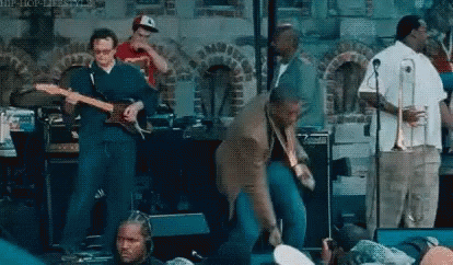 Group of Men Playing Instruments on Stage