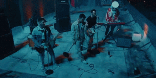 Group of Men Playing Instruments on Stage