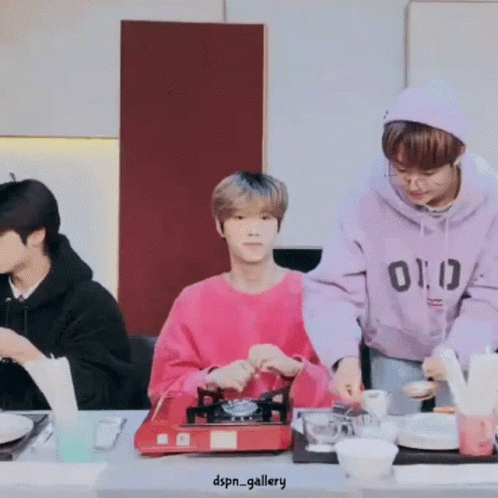 Group of Men Preparing Food at Table