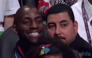 Group Of Men Sitting In Stadium One Smiling GIF