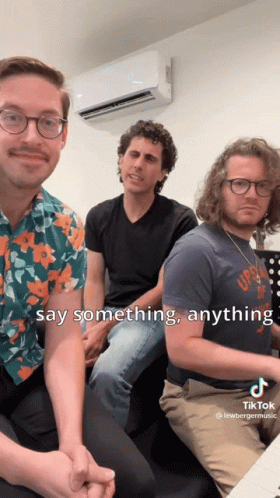 Group Of Men Sitting, One Says Something Anything GIF