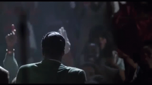 Group Of Men Standing Around Microphone GIF