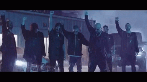 Group of Men Standing in Line Hands Up