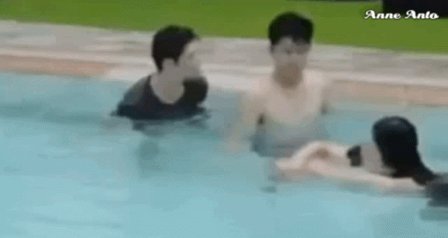 Group of Men Swimming in Pool