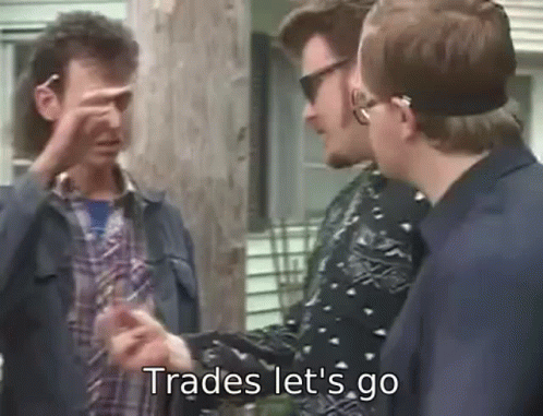 Group Of Men Talking One Pointing At Camera GIF