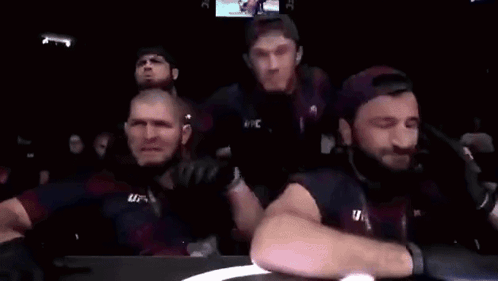 Group of Men Watching Boxing Match Screaming