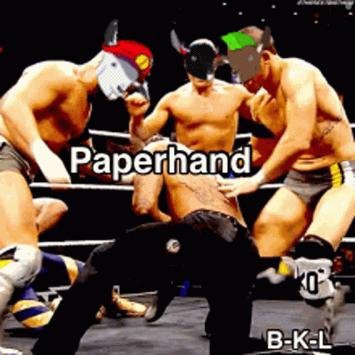 Group of Men Wrestling in Ring With Paperhand