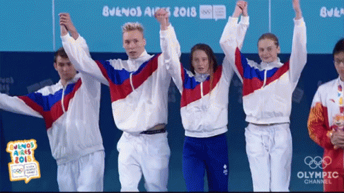 Group of Olympic Athletes Raising Arms
