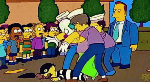 Group of People Around Lying Man