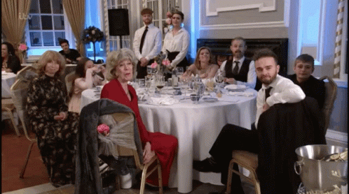 Group of People at Table With Champagne