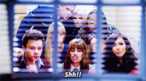 Group Of People Behind Window Saying Shhll GIF