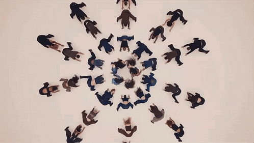 Group of People Dancing Around Letter T