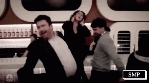 Group Of People Dancing Beside SMP Sign GIF
