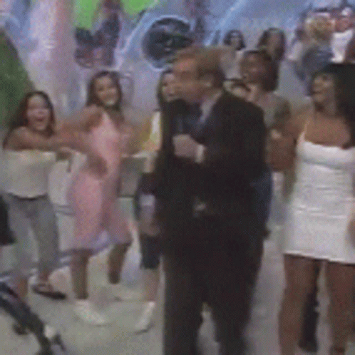 Group Of People Dancing In Front Of Cat Painting GIF