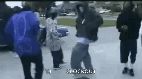 Group of People Dancing in Parking Lot