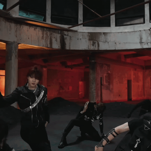 Group of People Dancing in Room With Red Lights