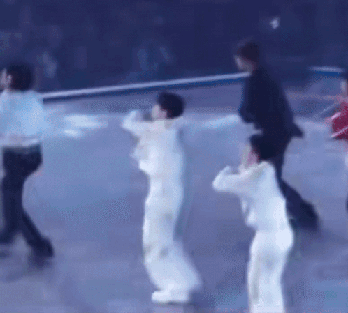 Group of People Dancing on Blue Surface