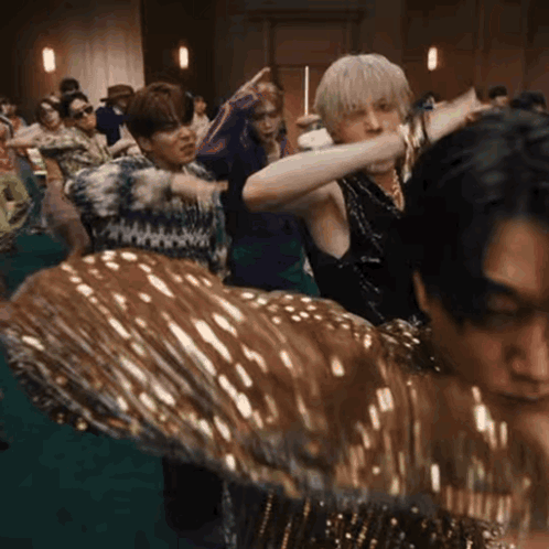 Group of People Dancing on Green Floor
