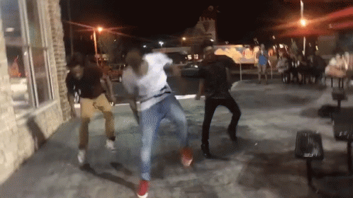 Group of People Dancing on Sidewalk