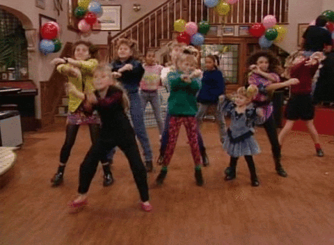 Group of People Dancing With Balloons