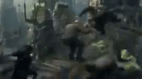 Group of People Fighting in Blurred Scene