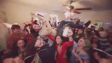 Group of People Having a Party in Living Room