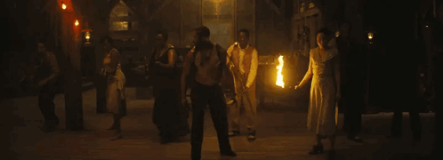 Group of People Holding Fire Torches
