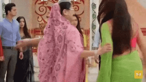 Group Of People Holding Hands In A Room GIF