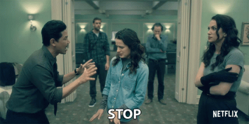 Group of People Holding Stop Sign