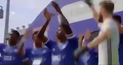 Group Of People Holding Trophy GIF