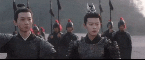 Group Of People In Armor In Front Of Building With Chinese Writing GIF