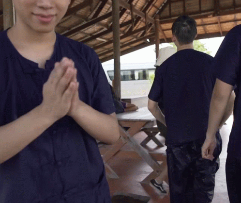 Group Of People In Blue Shirts Praying GIF