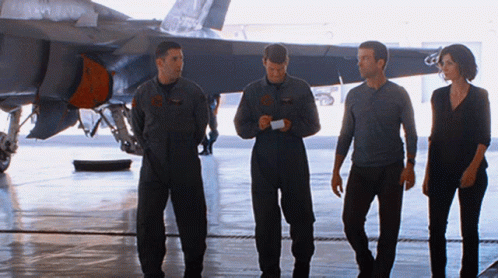Group of People in Front of Plane with C Tail