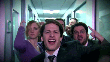 Group of People in Hallway One Man Pointing Up