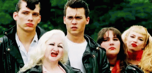Group Of People In Leather Jackets Making Funny Faces GIF
