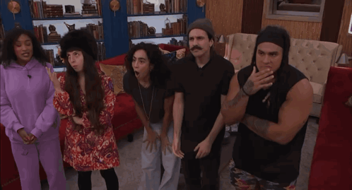 Group of People in Living Room, One With Tattoo Saying I Love You
