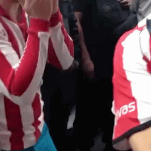 Group of People in Red and White Jerseys