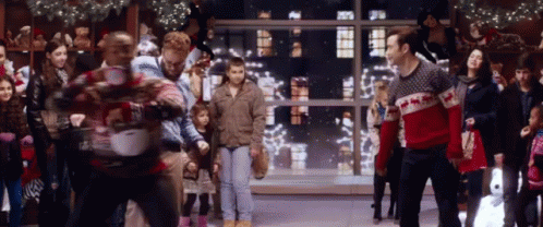 Group of People in Ugly Sweaters Dancing