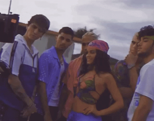 Group Of People Including Woman In Purple Top GIF