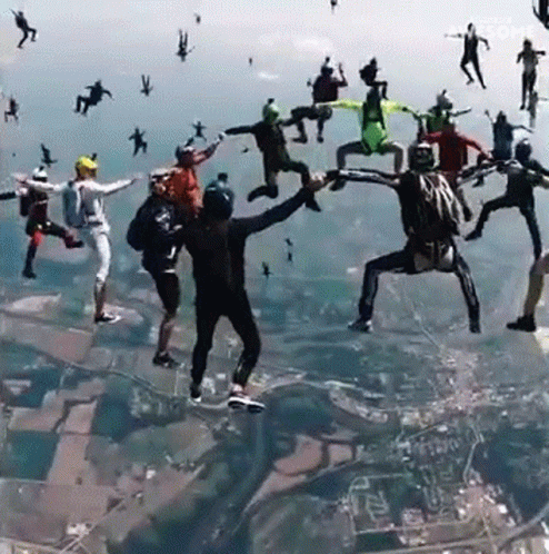 Group of People Jumping Out of Plane Saying Awesome