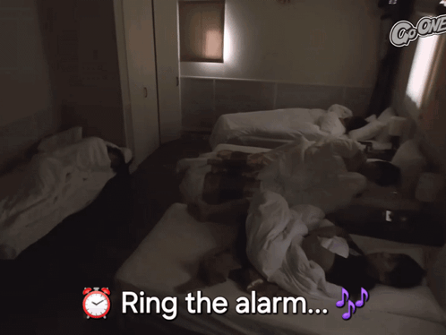 Group Of People Laying On Bed Ring The Alarm GIF