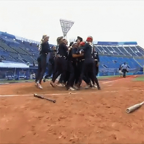 Group of People on Dirt Baseball Field