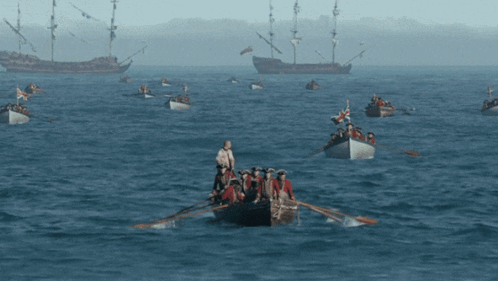 Group of People Rowing Boats
