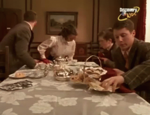 Group Of People Sitting Around Table Discovery Kids GIF