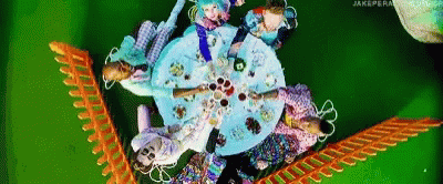 Group of People Sitting Around Table With Plates of Food